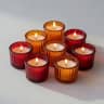 Traditional glass vigil candles with warm flames