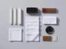 Complete funeral kit neatly arranged: candles, white handkerchiefs, towel, incense and charcoal