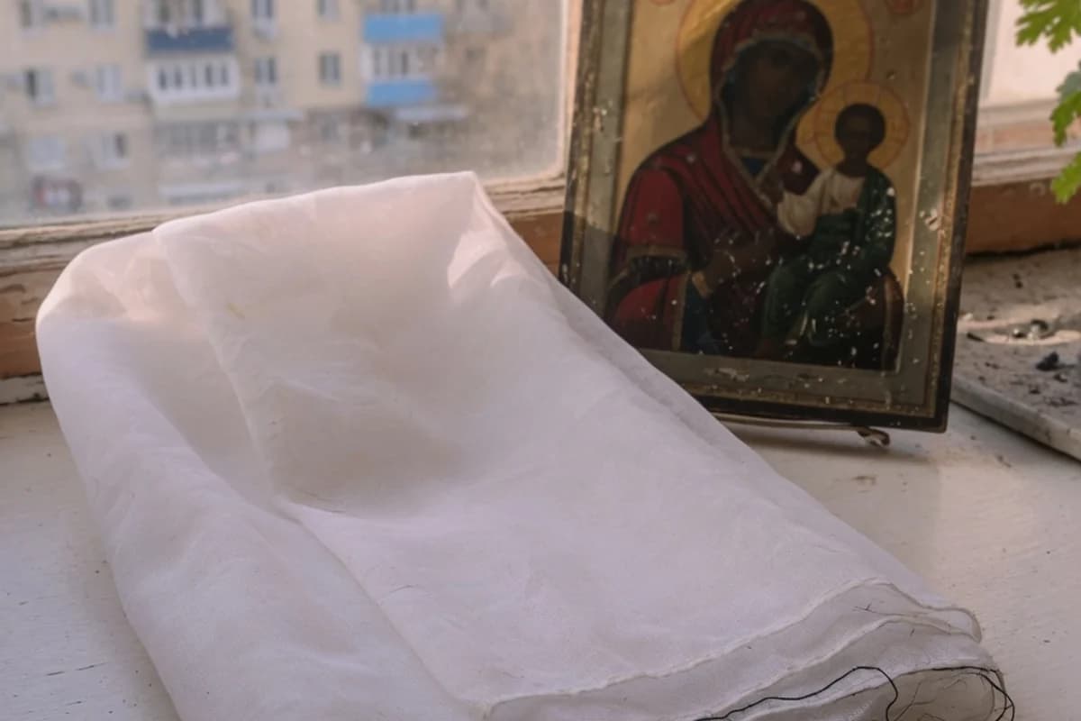 Folded white veil beside a small icon, no readable details, Sector 3, Bucharest