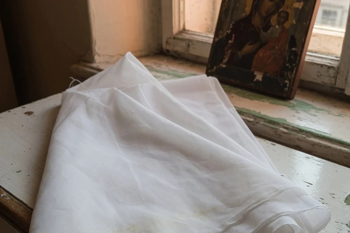 Folded white veil beside a small icon, no readable details, Sector 5, Bucharest