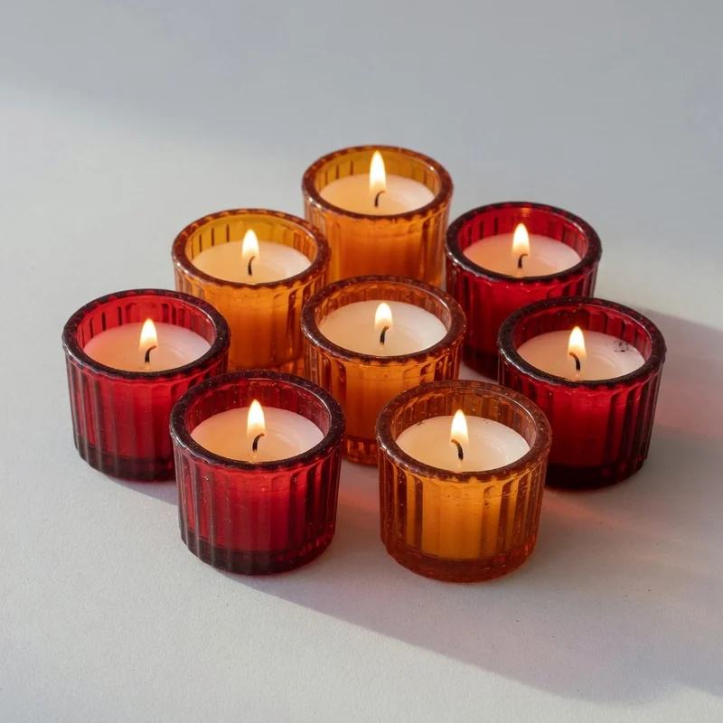 Traditional glass vigil candles with warm flames