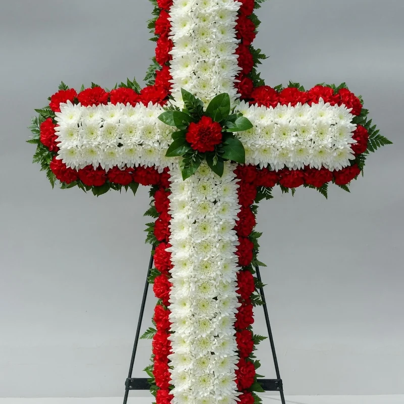 Cross-shaped arrangement of chrysanthemums and carnations