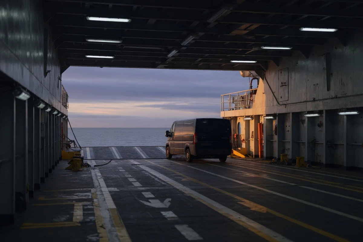 Cross-Channel ferry vehicle deck at dawn — the route from the United Kingdom